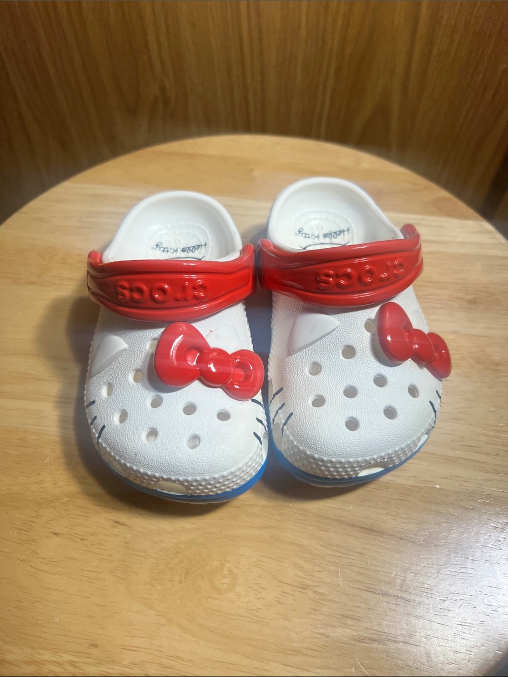 CROCS White Kids Clog Sandals with Red Bow Accents